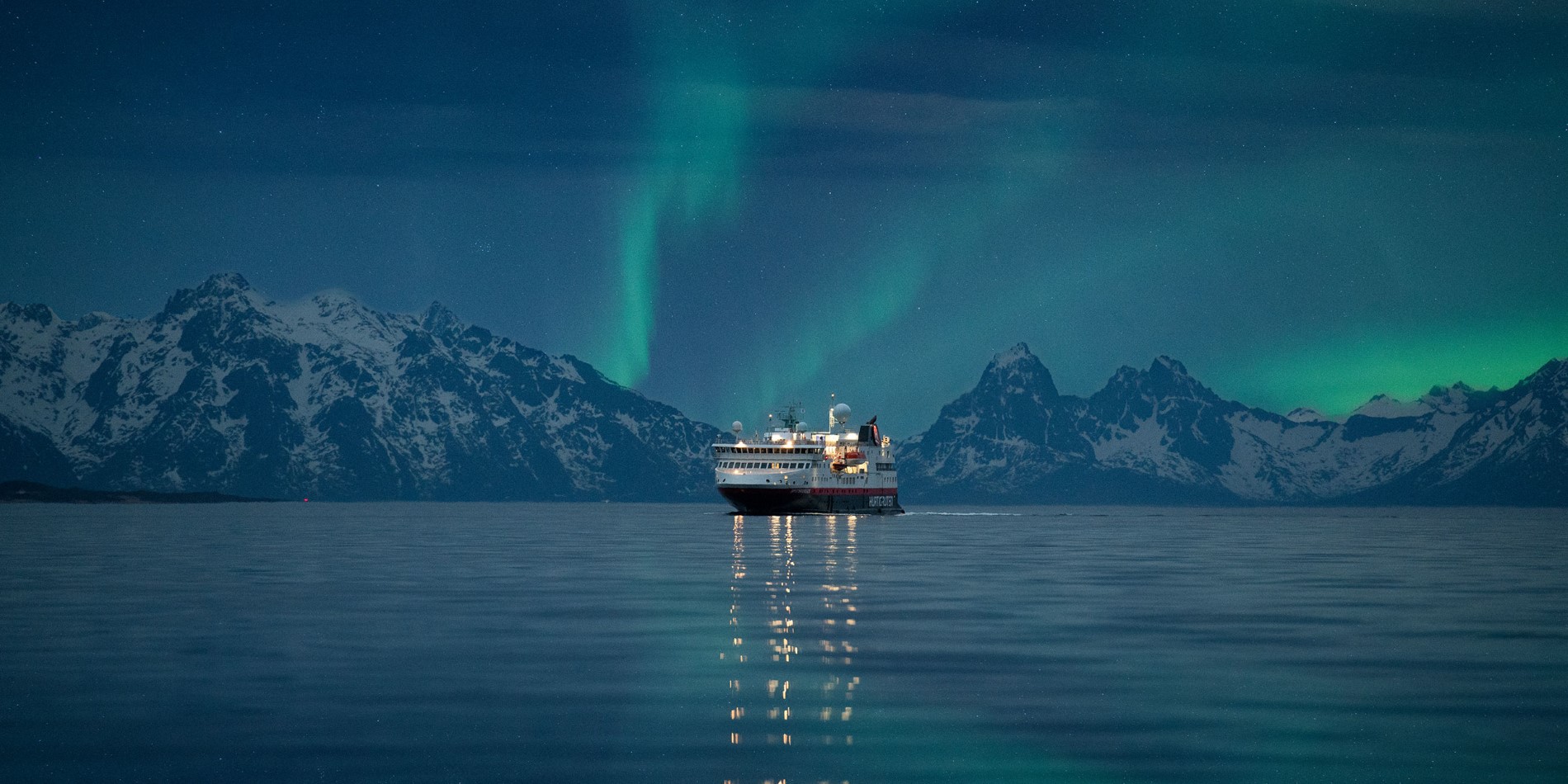MS Spitsbergen sailing under the northern lights between Stokmarknes and Sortland
